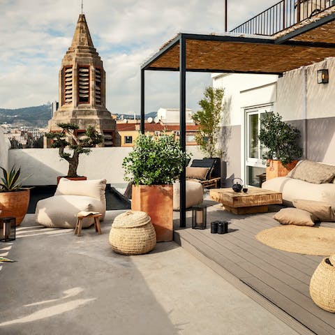 Pour yourself a glass of Spanish wine and take in skyline views over the city from your terrace