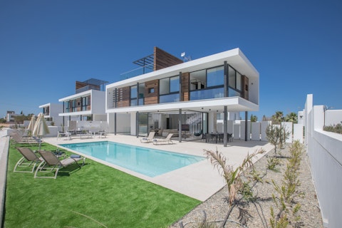Stretch out on sun loungers beside the outdoor pool