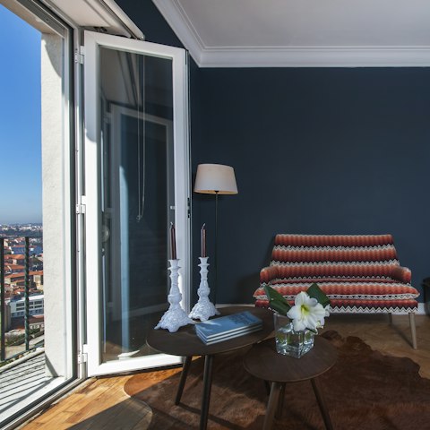 Fling the door open and watch the hustle and bustle of the city below