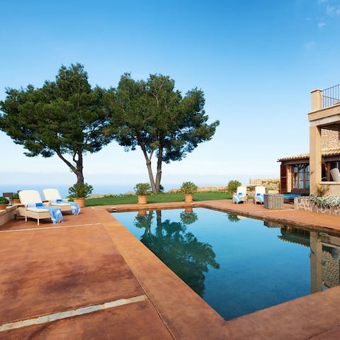 Take a dip in the pool while gazing over the Mediterranean Sea