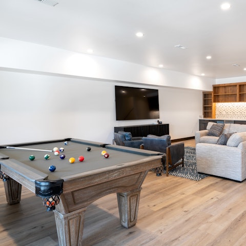 Unwind with family fun and competition in the games room