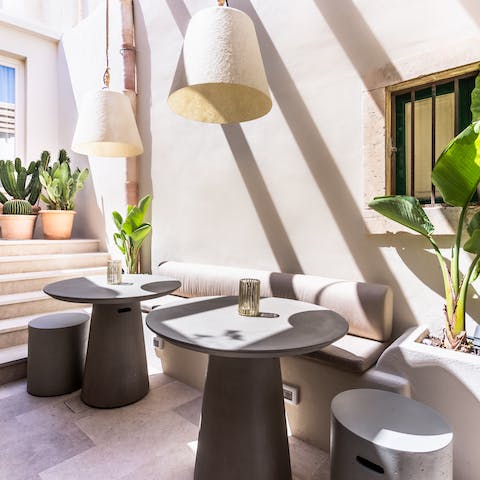 Enjoy a bottle of wine in the sunshine on the pretty courtyard