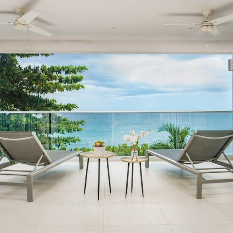 Relax with a cold drink and watch the waves come in and out