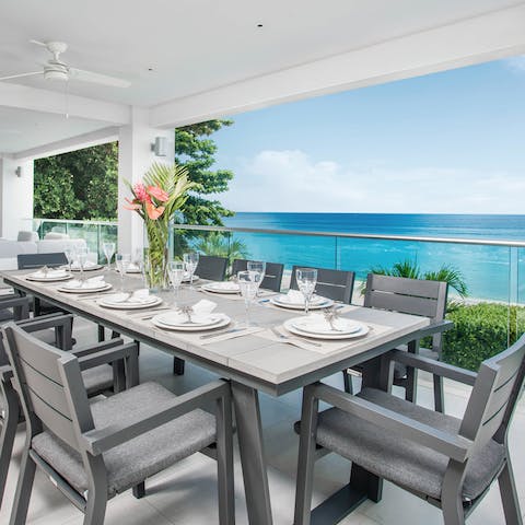 Gather for a big group meal on the balcony as boats drift by below
