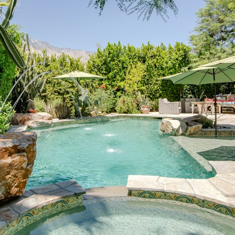 Cool off in the gorgeous pool surrounded by fountains and flora