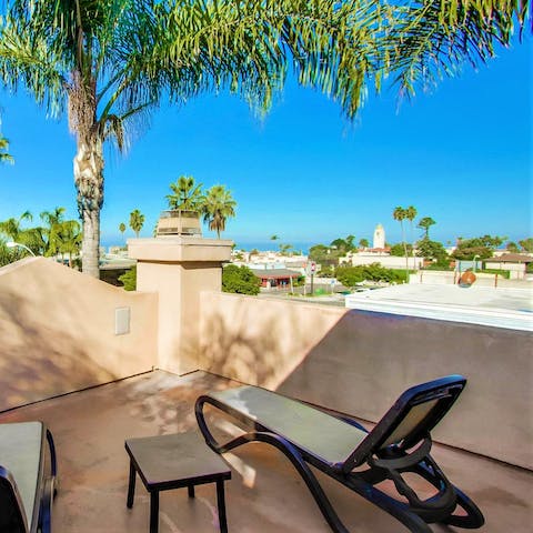 Sunbathe on the rooftop terrace overlooking the Pacific Ocean