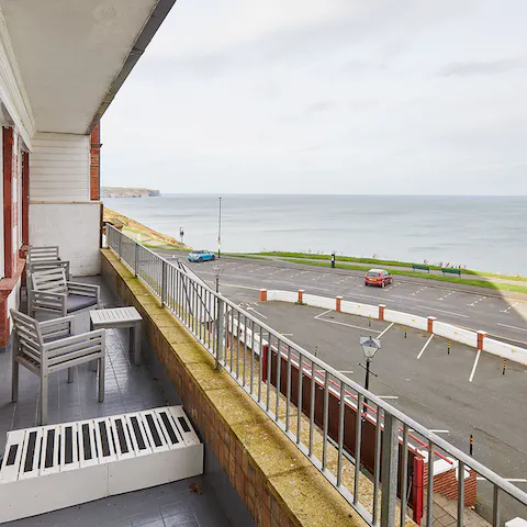 Step out onto the balcony and marvel at the sea views before you