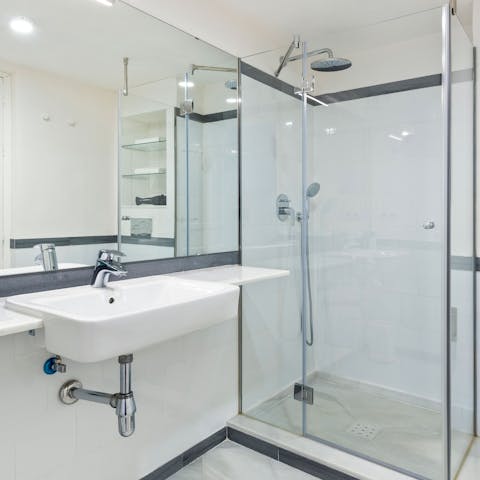 Freshen up in the large rainfall shower before dinner