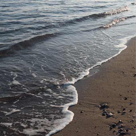 Feel the sand between your toes at Lindos Beach, a short drive from home