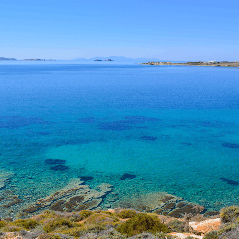Spend the day at the gorgeous Paralia Agia Irini, a short six-minute drive away, sipping on the icy cold local beers