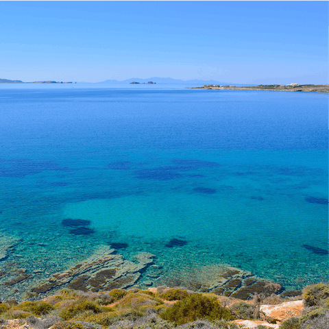 Spend the day at the gorgeous Paralia Agia Irini, a short six-minute drive away, sipping on the icy cold local beers