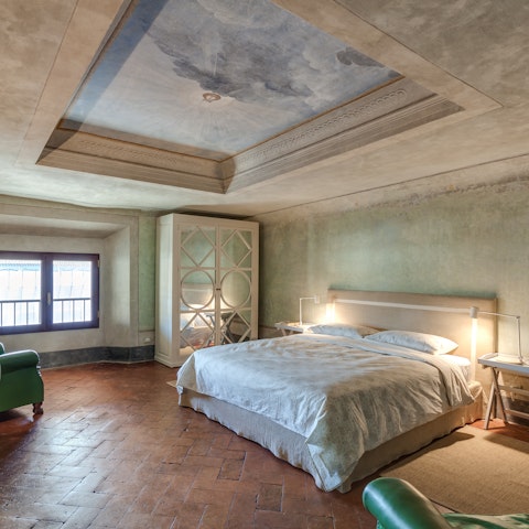 Admire the beautifully preserved frescoed ceilings