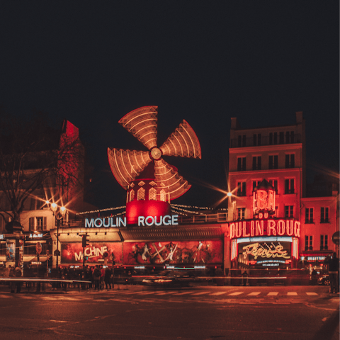 Sip Champagne while taking in a show at the Moulin Rouge, a five-minute walk away