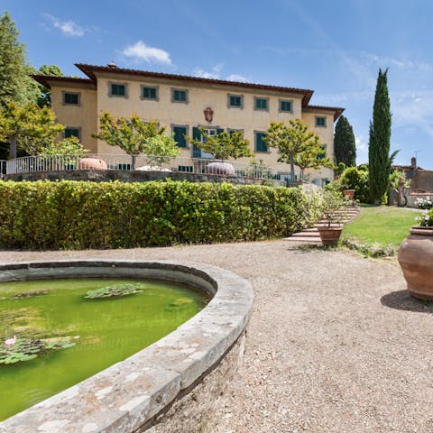 Wander between ponds, terraces and tennis courts in the extensive grounds