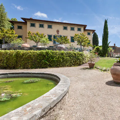 Wander between ponds, terraces and tennis courts in the extensive grounds