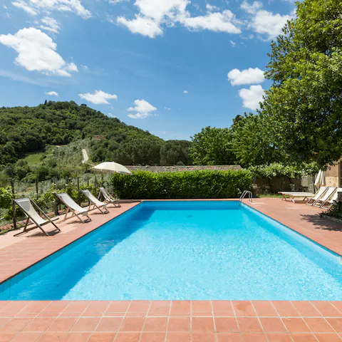 Float in the pool and breathe in the scene of the Tuscan hills