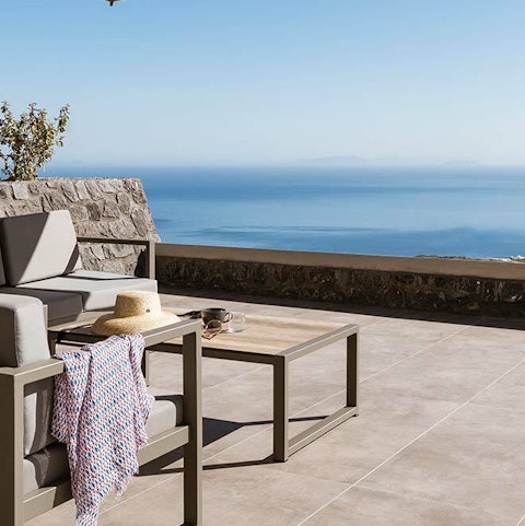 Unwind on the private terrace with endless sea views