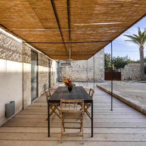 Dine alfresco around the outdoor dining table