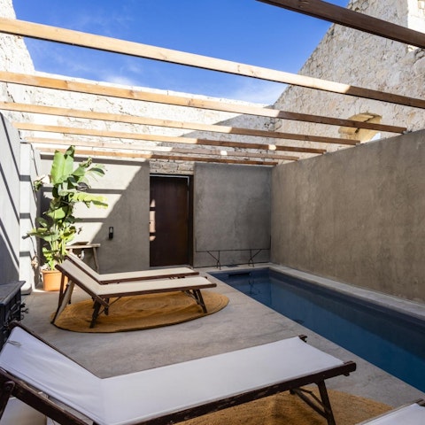 Relax in the sun by the private pool