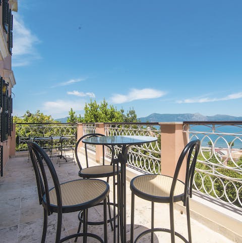 Enjoy a cocktail and gorgeous scenery on the balcony