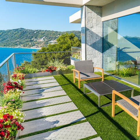 Sip an ouzo aperitif on the balcony with gorgeous sea views