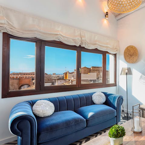 Gaze out to views of Granada's rooftops from the windows