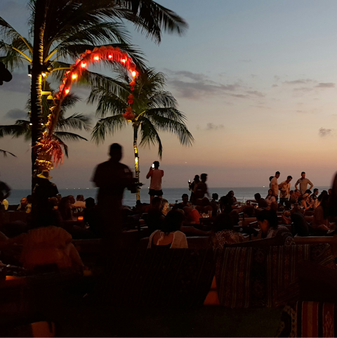 Spend evenings sipping cocktails at Seminyak beach, a twenty-minute walk away