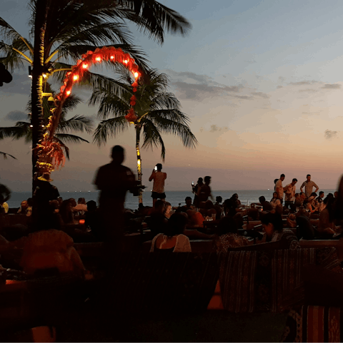 Spend evenings sipping cocktails at Seminyak beach, a twenty-minute walk away