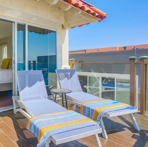 Soak up the sunshine from one of the loungers