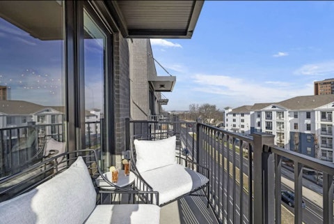 Head to the balcony and soak up the afternoon with a drink in hand