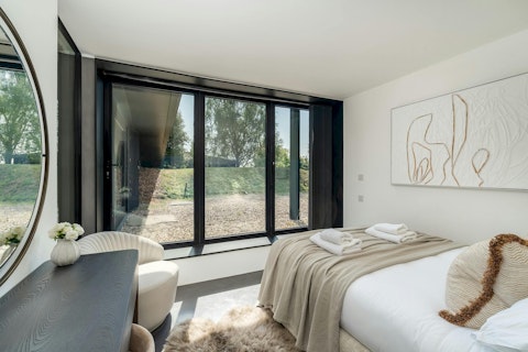 Wake to green views across the grounds