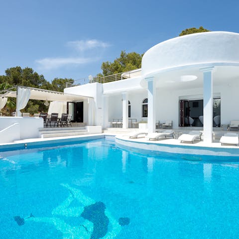 Dive into the azure water of the heated infinity pool