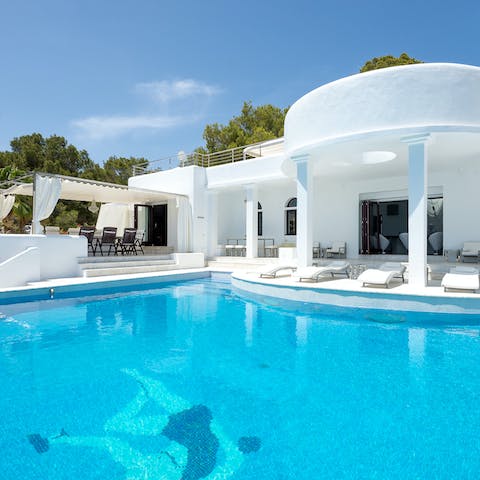 Dive into the azure water of the heated infinity pool