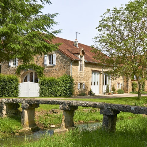 A pretty stream sits at the bottom of the garden