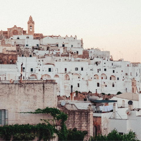 Visit the white-washed old town in Ostuni – a short drive away