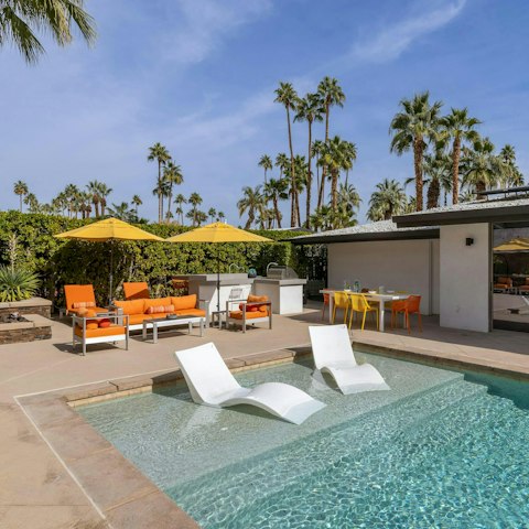 Soak up the sun from the pool's tanning shelf