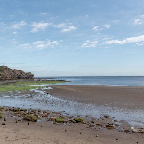 Go for morning strolls along Sandsend Beach, a fifteen-minute walk away