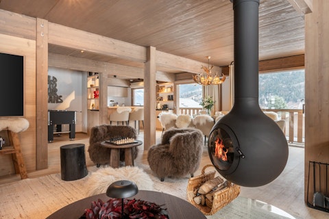 Cosy up in front of the fireplace after a day on the slopes