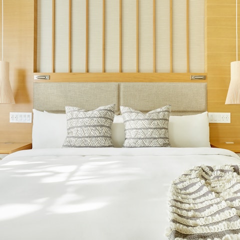 Fall into a lovely sleep in the bedroom, with soft and serene interiors
