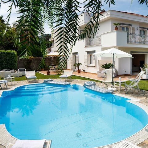 Make yourself comfortable on the pool floats as you sunbathe
