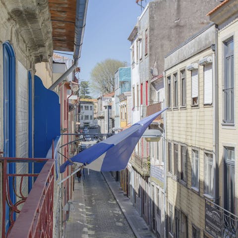 Perch by the Juliet balcony with your morning coffee while taking in colourful views of your street