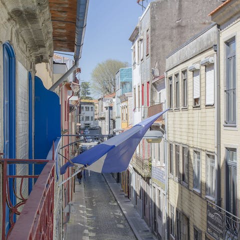 Perch by the Juliet balcony with your morning coffee while taking in colourful views of your street