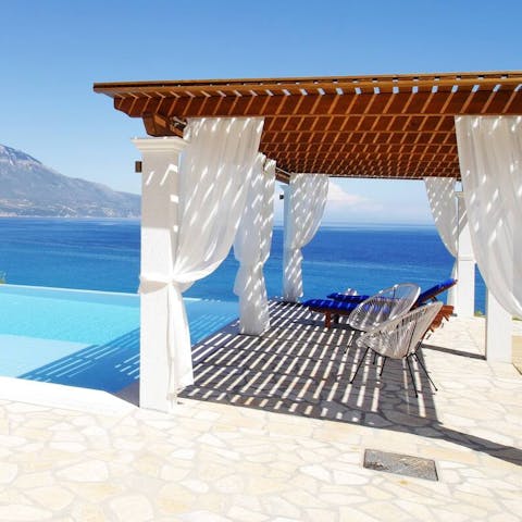 Escape the sunshine under the breezy pergola