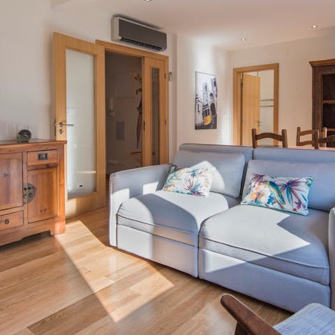 Get cosy in the bright and comfy living room after a day exploring Lisbon