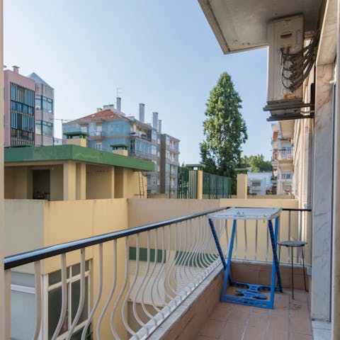 Step out onto your private balcony and enjoy the blue skies above Lisbon