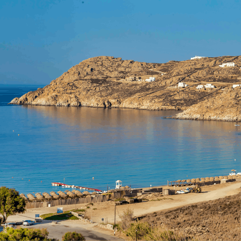 Sink your feet into the sand at Elia beach, a two-minute walk away