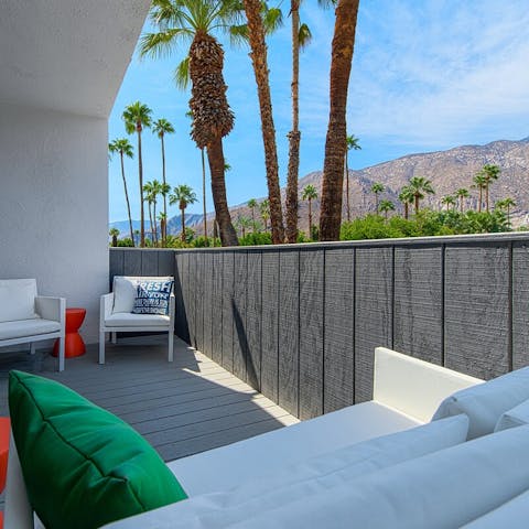 Indulge in a glass of wine while admiring the mountain views