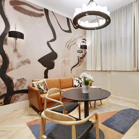 Kick back in the stylish living area with a glass of French wine after a day of exploring the city