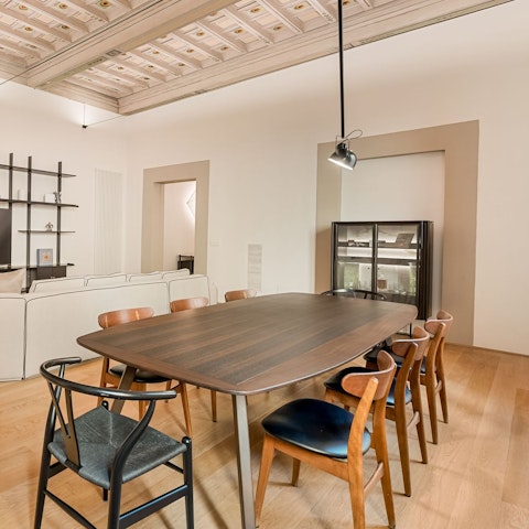 Dine beneath a hand-painted coffered ceiling