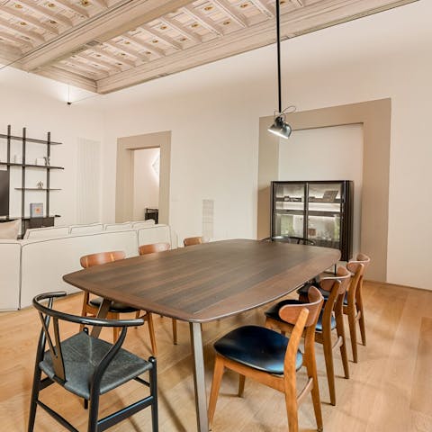 Dine beneath a hand-painted coffered ceiling